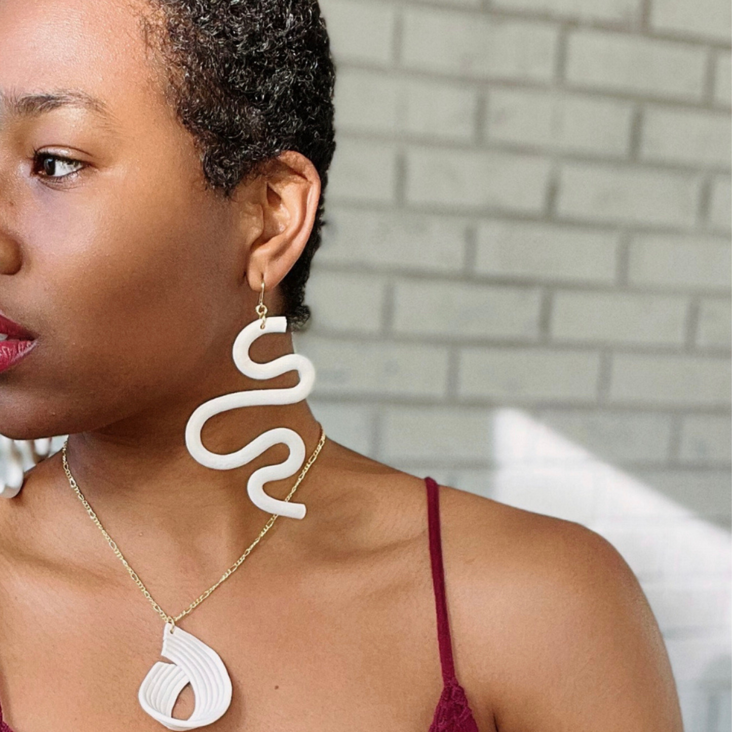 Handmade SELENE Swiggle Earrings crafted from polymer clay, featuring intricate artwork and modern geometric designs, lightweight and waterproof for a bold and unique accessory statement.