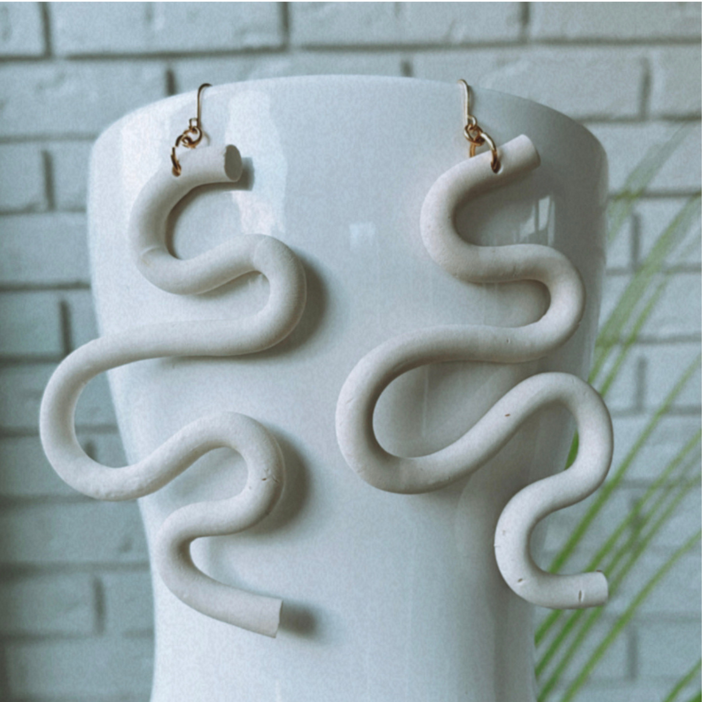 Handmade SELENE Swiggle Earrings crafted from polymer clay, featuring intricate artwork and modern geometric designs, lightweight and waterproof for a bold and unique accessory statement.