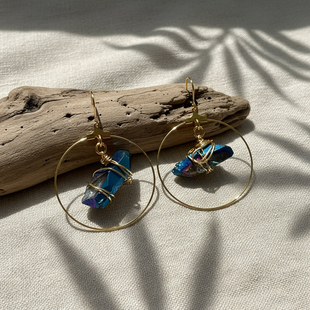 Stunning Quartz Hoop Earrings - Handcrafted from 18k gold-plated metal and radiant raw quartz coated in iridescent titanium, these lightweight earrings are perfect for wearing alone or layering. Known as the master healer, clear quartz amplifies energy and promotes clarity.
