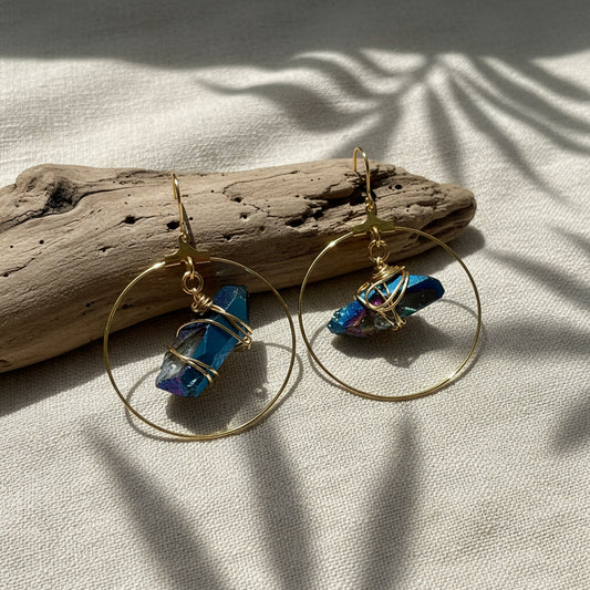 Stunning Quartz Hoop Earrings - Handcrafted from 18k gold-plated metal and radiant raw quartz coated in iridescent titanium, these lightweight earrings are perfect for wearing alone or layering. Known as the master healer, clear quartz amplifies energy and promotes clarity.