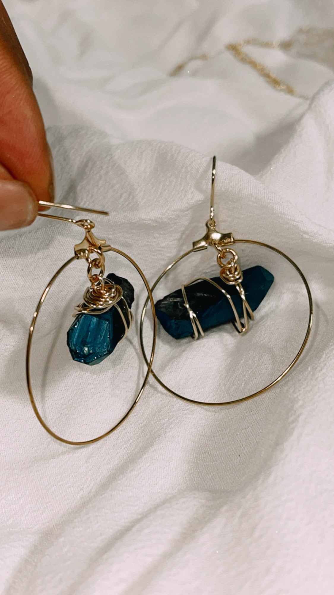 Stunning Quartz Hoop Earrings - Handcrafted from 18k gold-plated metal and radiant raw quartz coated in iridescent titanium, these lightweight earrings are perfect for wearing alone or layering. Known as the master healer, clear quartz amplifies energy and promotes clarity.