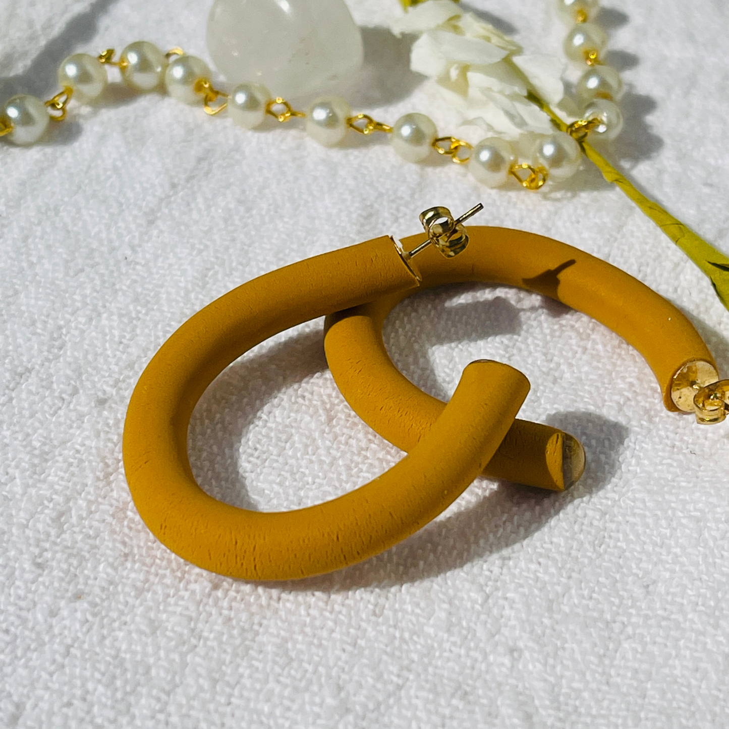 Earthy Hoops - Handcrafted polymer clay earrings that blend style and comfort. These lightweight hoops offer natural elegance and are perfect for any outfit.