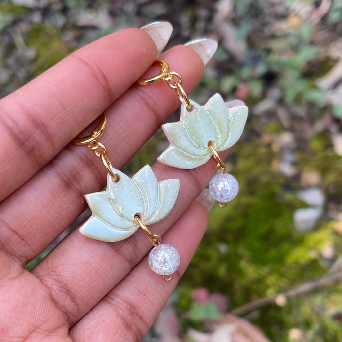 Green handcrafted Lotus Flower Earrings made from lightweight polymer clay, symbolizing purity and resilience. Unique, lead and nickel-free jewelry, perfect for sensitive ears.