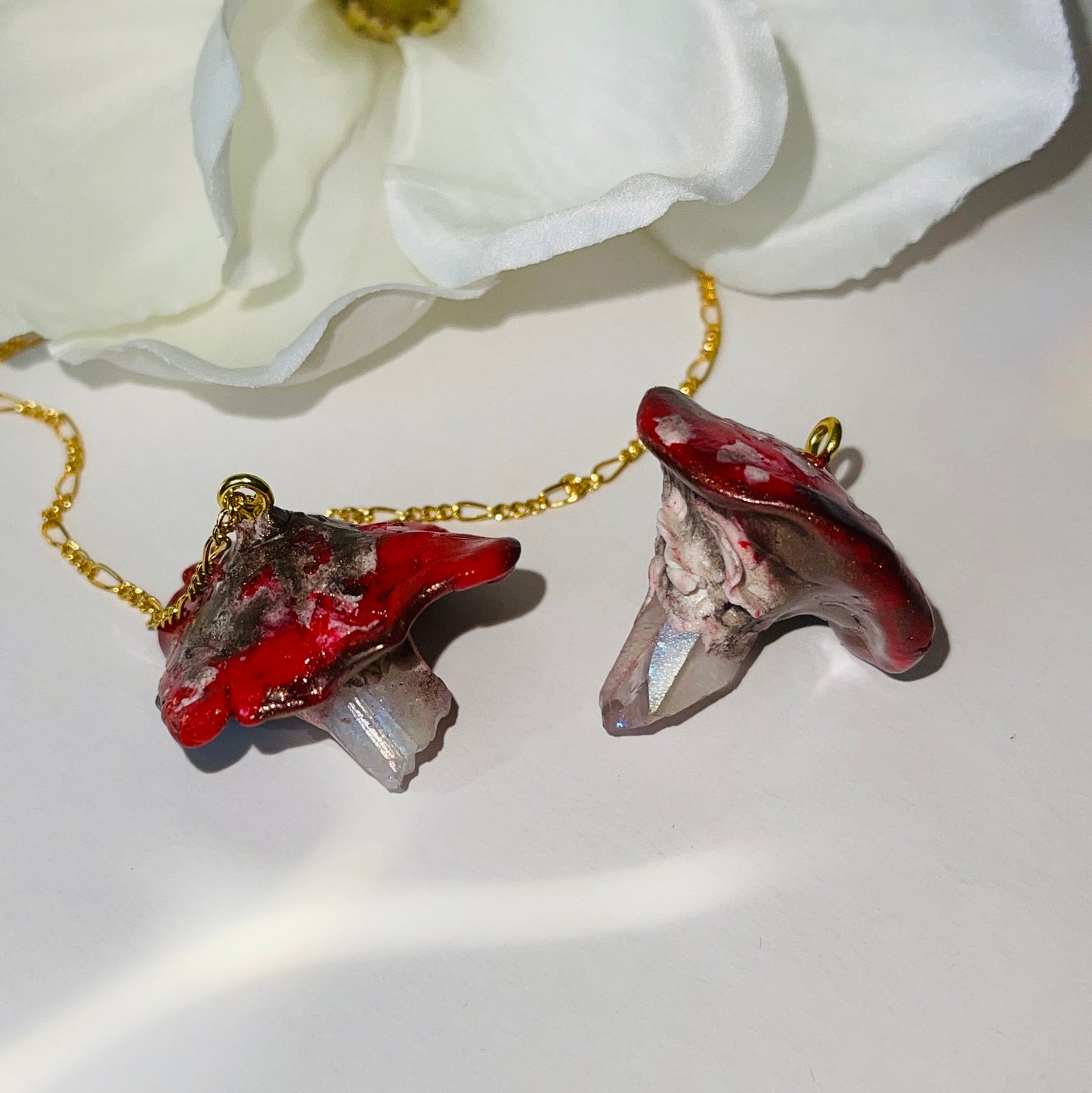 Handcrafted Toadstool Mushroom Necklace made from polymer clay with a shimmering quartz crystal, showcasing unique artistry and whimsical design, perfect for adding a magical touch to any outfit.
