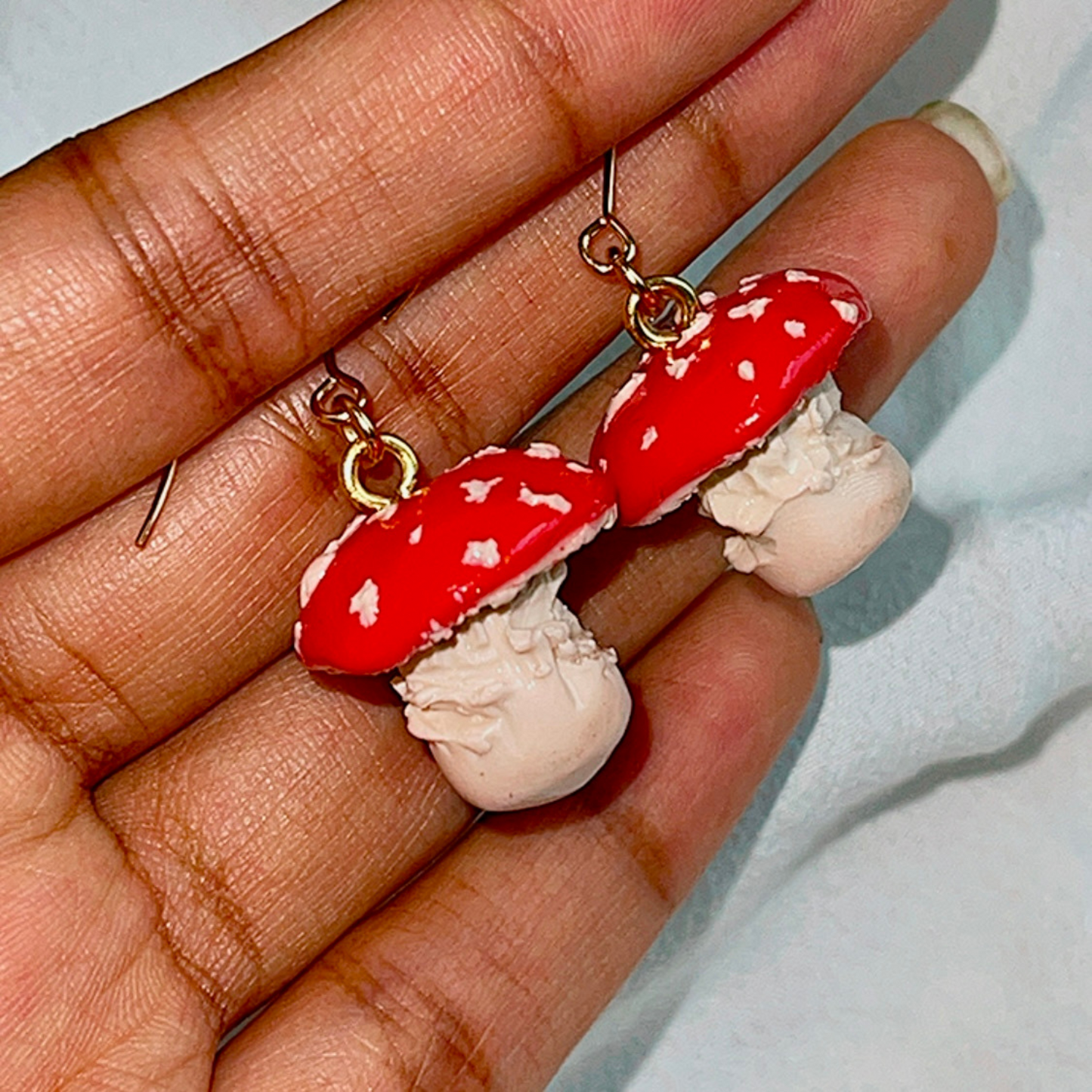 Handcrafted Toadstool Mushroom Earrings made from high-quality polymer clay, featuring intricate details and a whimsical design, perfect for adding a playful charm to any outfit.