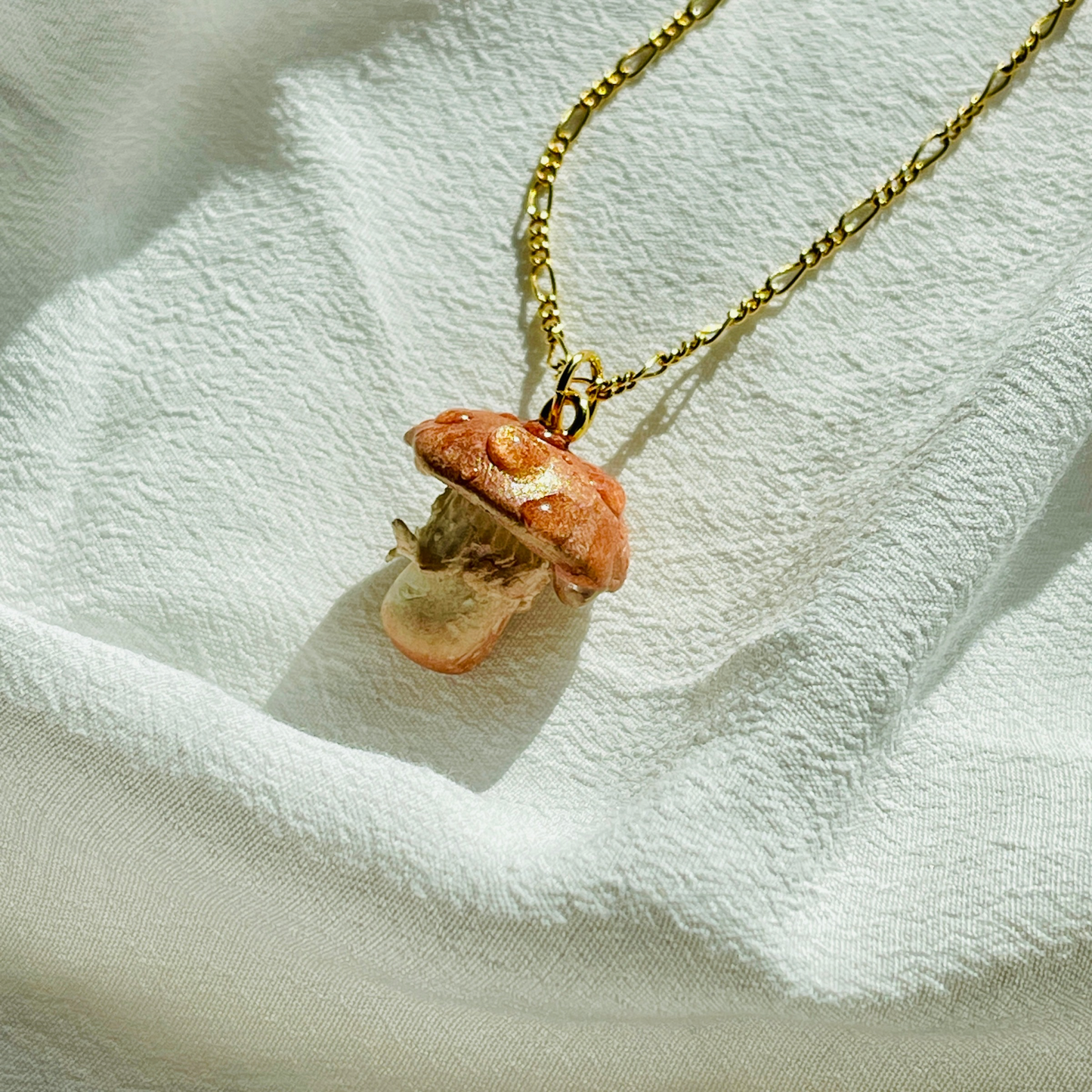 Handcrafted Woodland Mushroom Necklace made from polymer clay, featuring intricate details and a whimsical design, perfect for adding a touch of nature-inspired charm to any outfit.