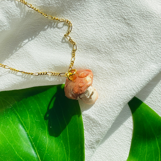 Handcrafted Woodland Mushroom Necklace made from polymer clay, featuring intricate details and a whimsical design, perfect for adding a touch of nature-inspired charm to any outfit.