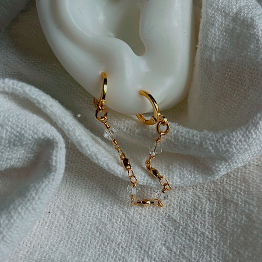 The Starlight Double Piercing Earring - a stunning and lightweight handmade accessory designed for everyday wear. This elegant earring is waterproof and tarnish-resistant, making it a perfect choice for upgrading your style. Ideal for those with double piercings.