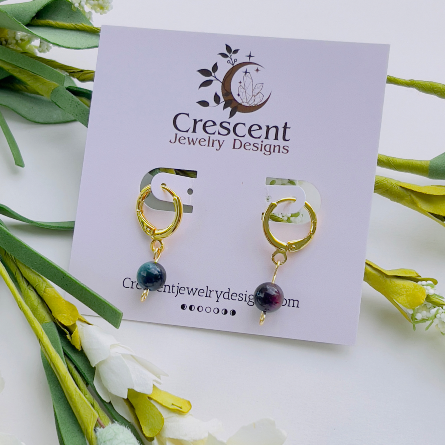"Handmade Rainbow Tiger Eye Earrings featuring a stunning crystal that harmonizes the solar plexus, heart, and third eye chakras. Crafted from lightweight 18k gold-filled stainless steel, these dainty earrings exude elegance and positive energy. Lead and nickel-free for comfortable wear.