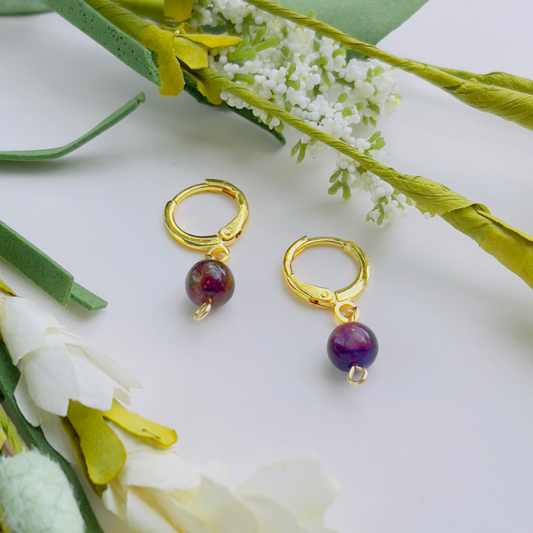 Handmade Rainbow Tiger Eye Earrings featuring a stunning crystal that harmonizes the solar plexus, heart, and third eye chakras. Crafted from lightweight 18k gold-filled stainless steel, these dainty earrings exude elegance and positive energy. Lead and nickel-free for comfortable wear.