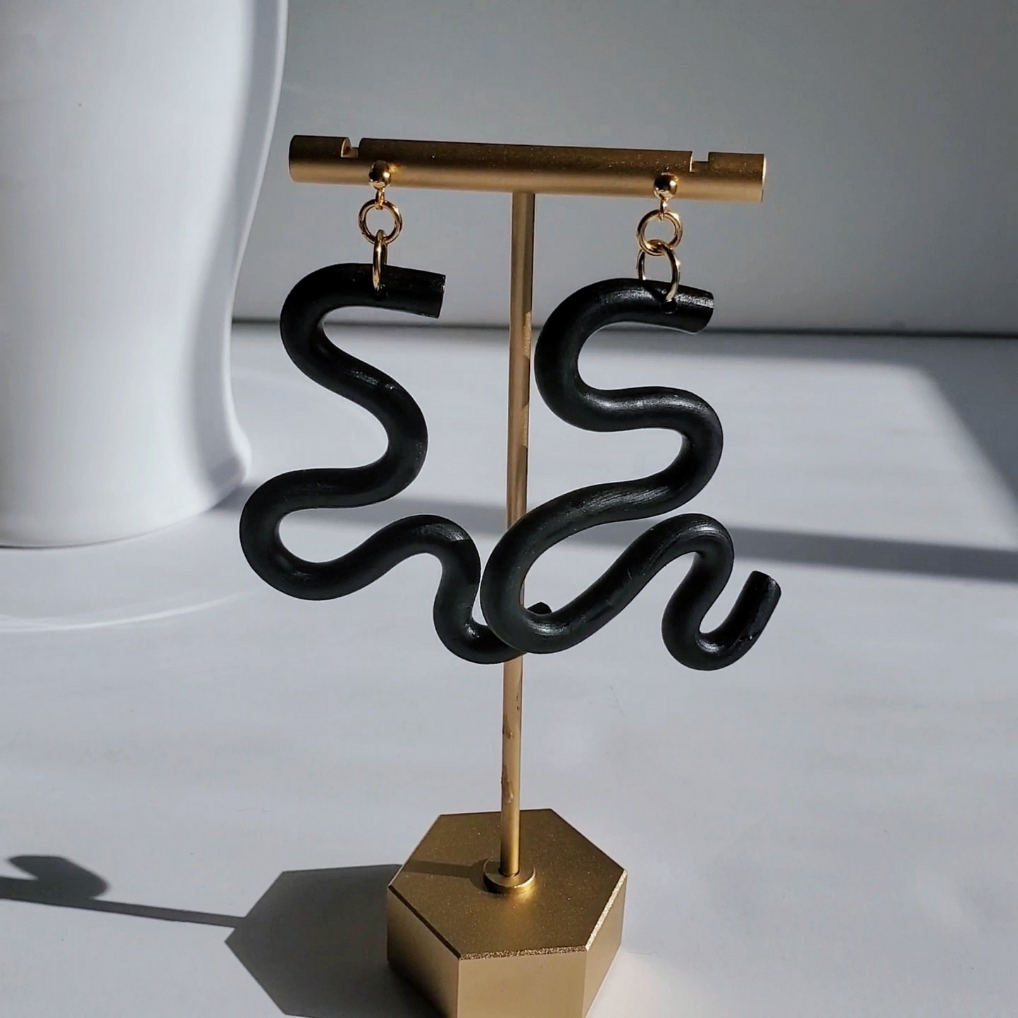Handmade SELENE Swiggle Earrings crafted from polymer clay, featuring intricate artwork and modern geometric designs, lightweight and waterproof for a bold and unique accessory statement.