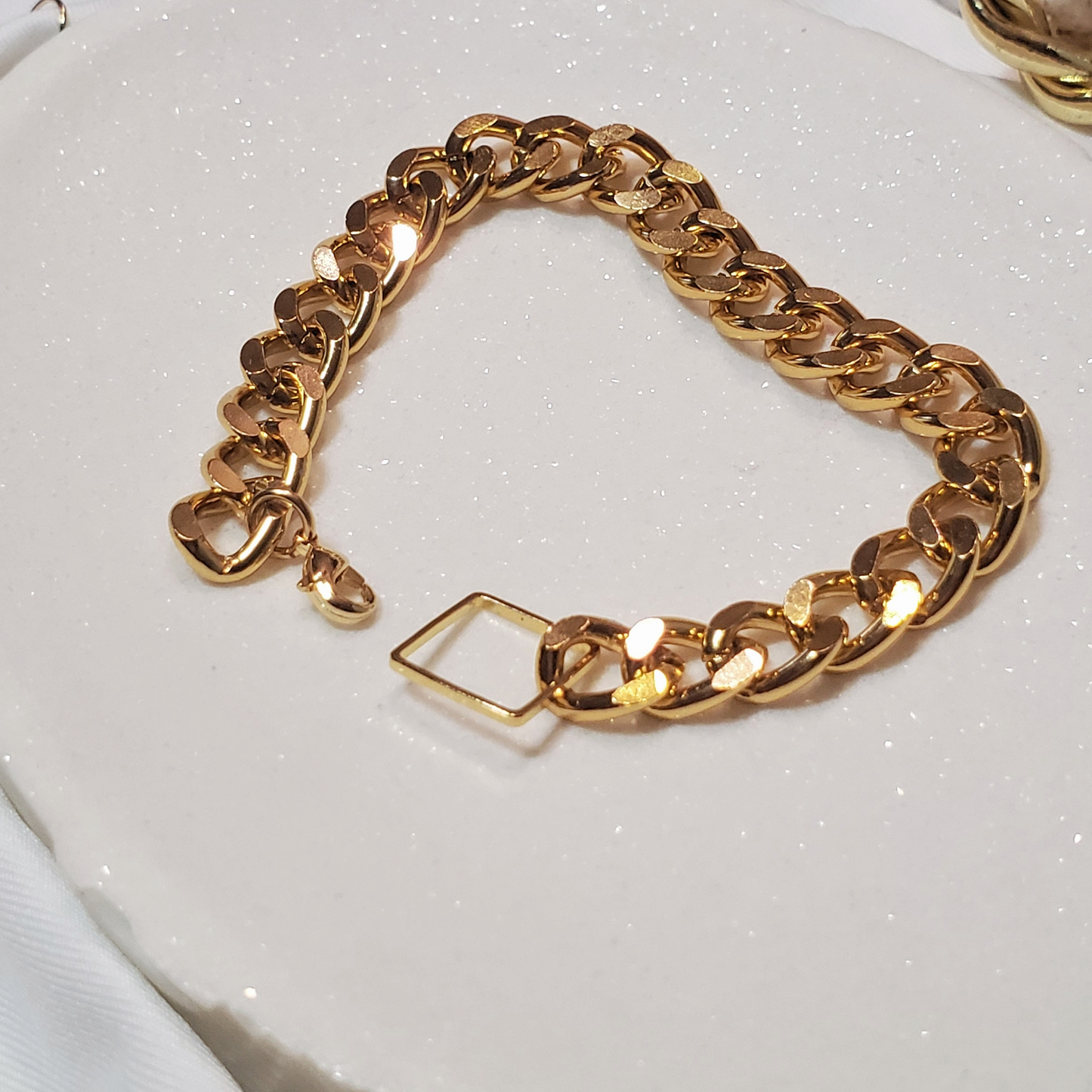 Curb Chain Bracelet - a perfect blend of simplicity, style, and boldness with a modern design. Lightweight and easy to wear, this bracelet is ideal for making a chic statement or creating a trendy stacked look. Handmade from lead and nickel-free, hypoallergenic materials, it features a sleek curb chain and luxurious gold-plated stainless steel for durability and timeless appeal. A thoughtful gift option that complements any outfit.
