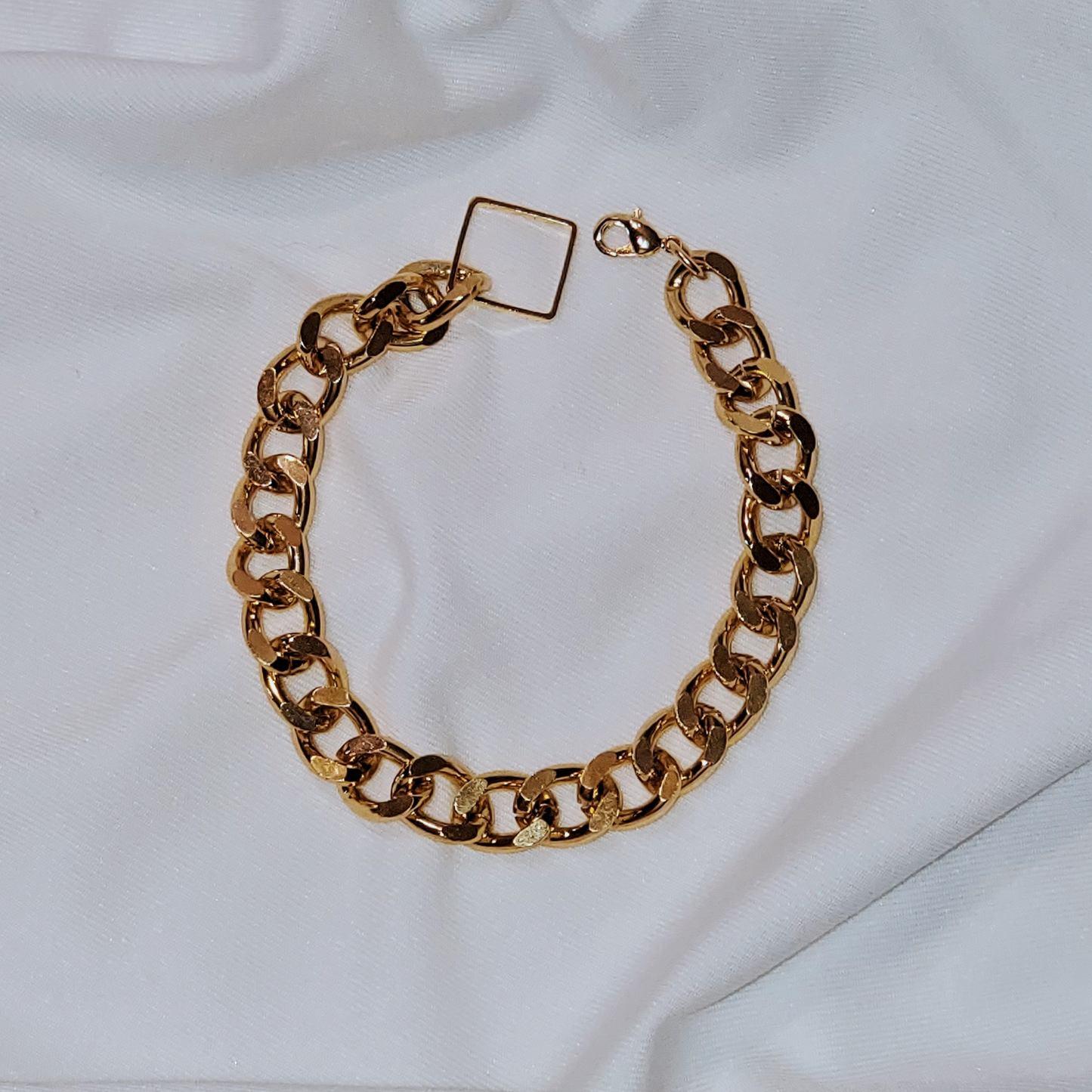 Curb Chain Bracelet - a perfect blend of simplicity, style, and boldness with a modern design. Lightweight and easy to wear, this bracelet is ideal for making a chic statement or creating a trendy stacked look. Handmade from lead and nickel-free, hypoallergenic materials, it features a sleek curb chain and luxurious gold-plated stainless steel for durability and timeless appeal. A thoughtful gift option that complements any outfit.