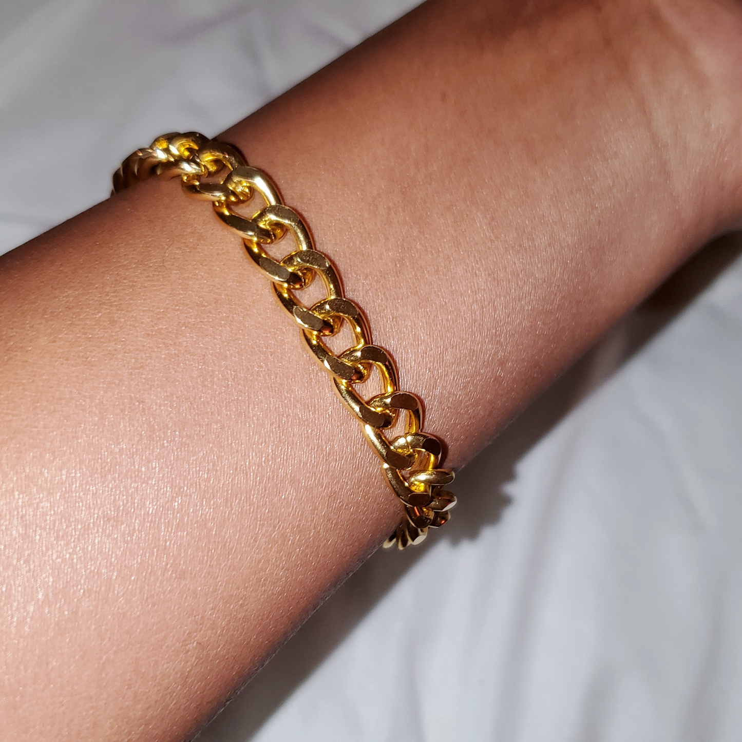 Curb Chain Bracelet - a perfect blend of simplicity, style, and boldness with a modern design. Lightweight and easy to wear, this bracelet is ideal for making a chic statement or creating a trendy stacked look. Handmade from lead and nickel-free, hypoallergenic materials, it features a sleek curb chain and luxurious gold-plated stainless steel for durability and timeless appeal. A thoughtful gift option that complements any outfit.