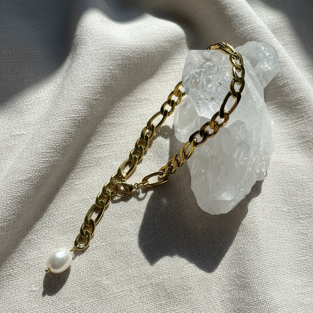 Exquisite 18k Gold Bracelet adorned with a single lustrous freshwater pearl, offering a blend of sophistication and elegance. Designed with hypoallergenic materials for skin comfort and featuring an adjustable fit, this bracelet is ideal for minimalist or layered styling, enhancing any outfit for everyday wear.