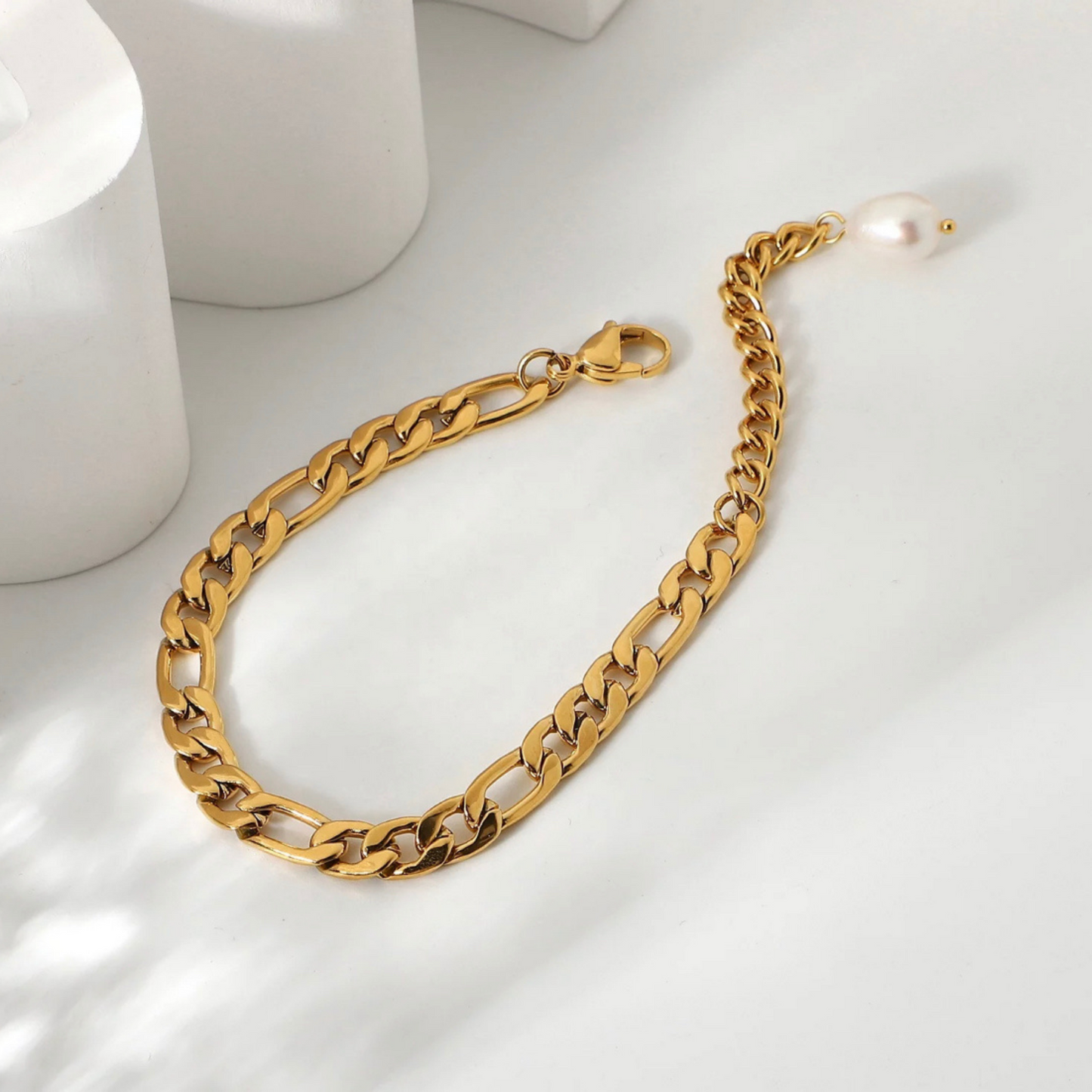 Exquisite 18k Gold Bracelet adorned with a single lustrous freshwater pearl, offering a blend of sophistication and elegance. Designed with hypoallergenic materials for skin comfort and featuring an adjustable fit, this bracelet is ideal for minimalist or layered styling, enhancing any outfit for everyday wear.