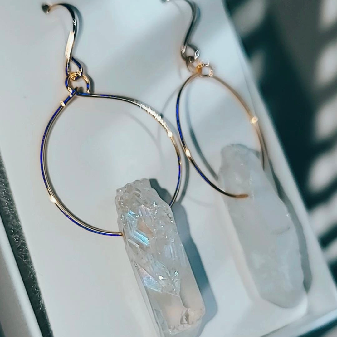 Close up of Quartz Hoop Earring - Stunning handcrafted earring with 18k gold-plated metal and raw quartz; lightweight and perfect for layering.