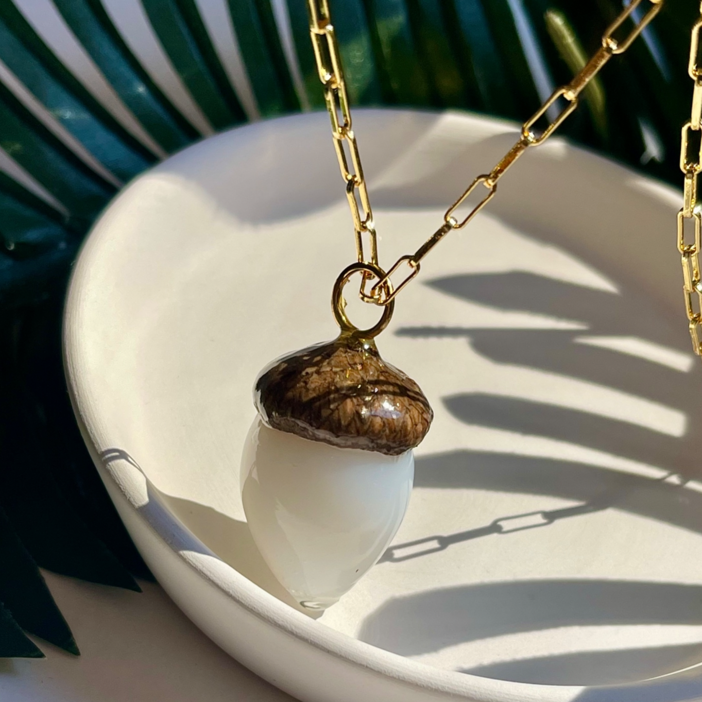 White acorn pendent gold necklace