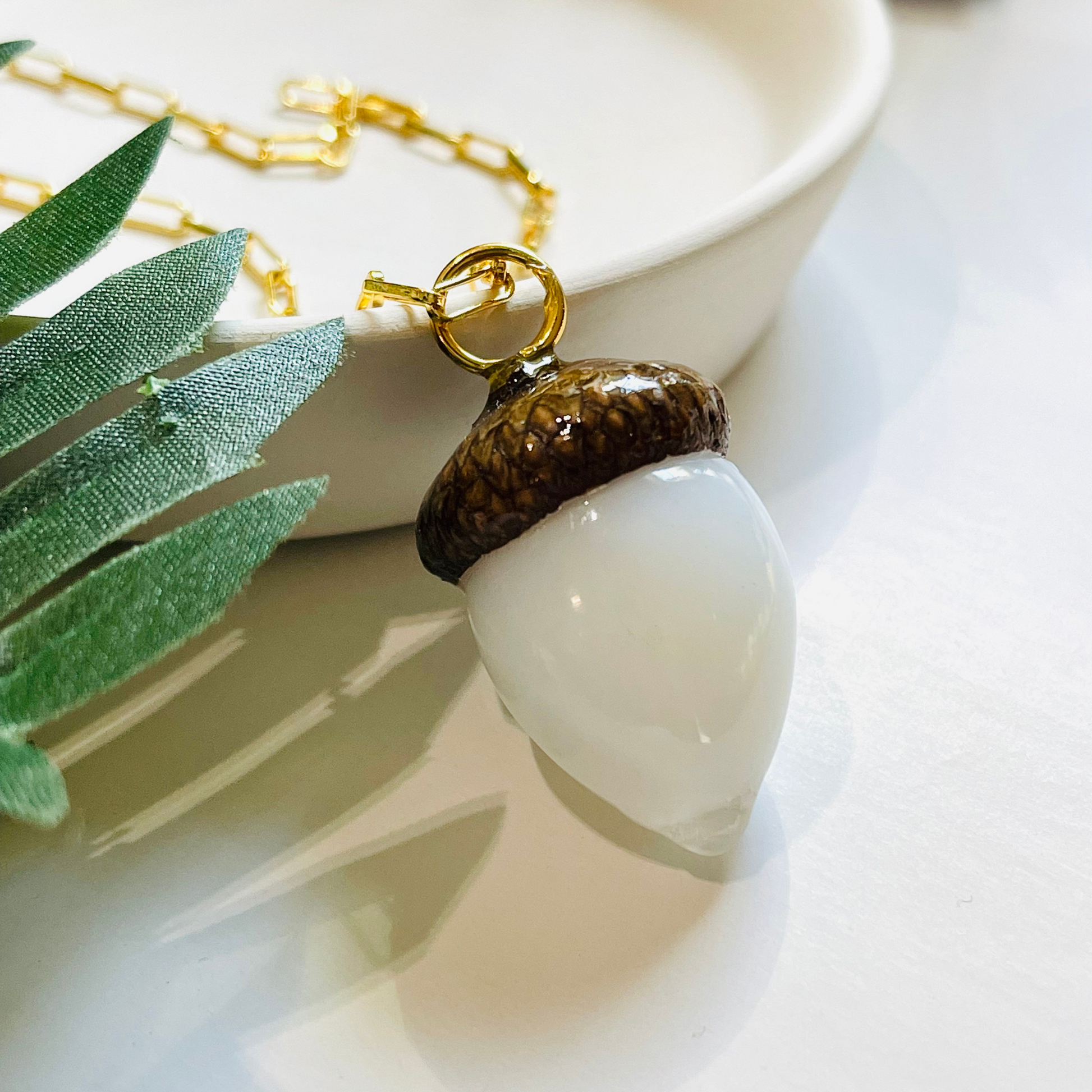 White acorn pendent gold necklace